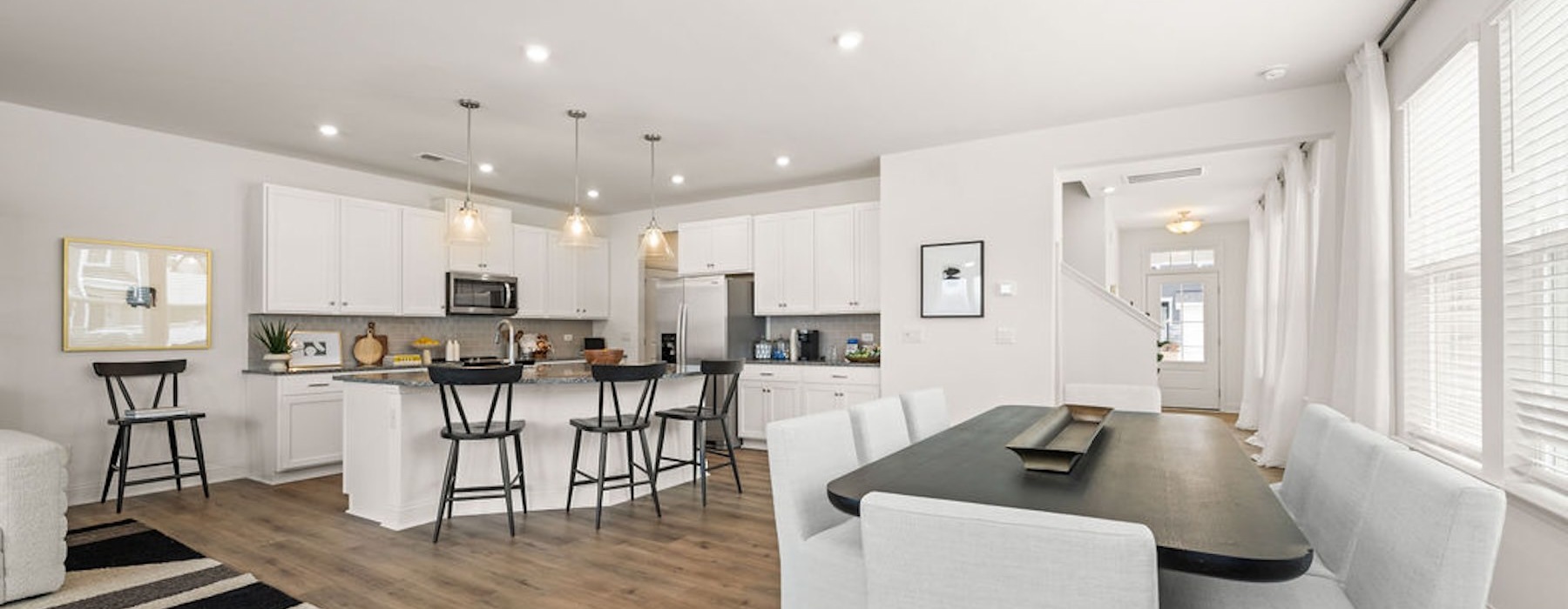 a large kitchen with a dining table