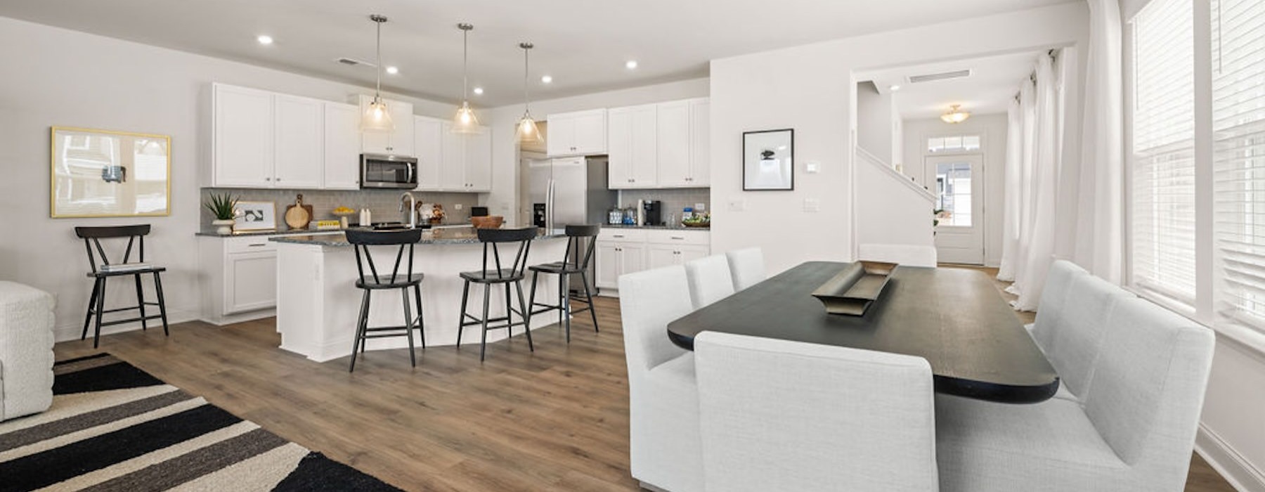 a large kitchen with a dining table