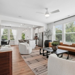 a living room with a tv and couches